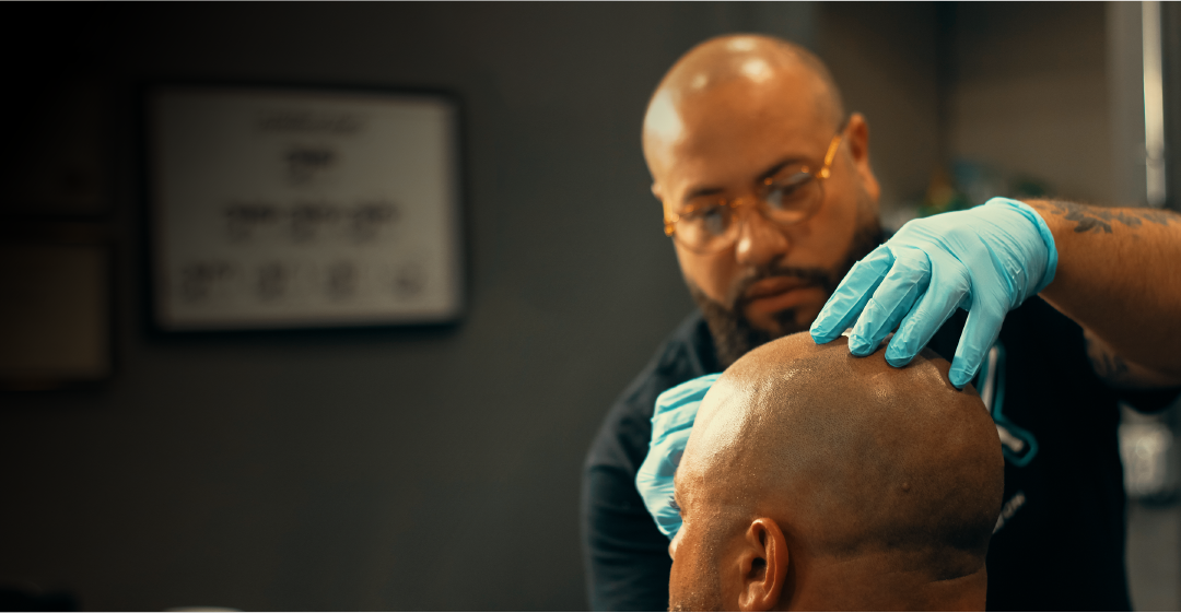 Alex assessing a client at the studio